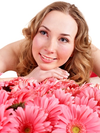 Happy young woman lying on flowers.の写真素材