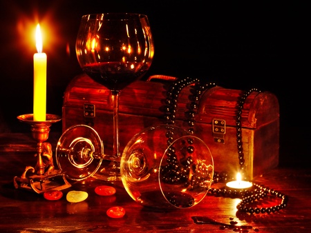 Two wine glass and candle on darkの写真素材