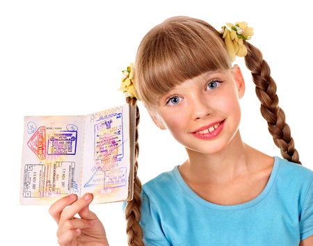 Little girl holding  passport. Foreign vacation.の写真素材