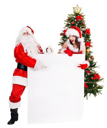 Santa claus and girl by christmas tree and banner. Isolated.の写真素材