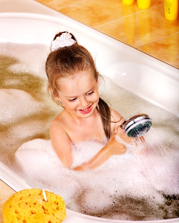 Child washing in bubble bath .の写真素材