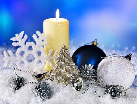 Christmas still life with snowflake and candle. Holiday decoration.の写真素材