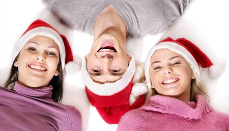 Group young people in santa hat lying  head to  head. の写真素材
