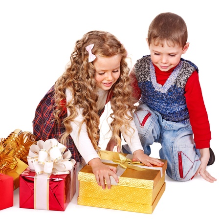 Children with gift box near Christmas tree. Isolated.の写真素材