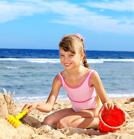 Little girl  playing on  beach.の写真素材