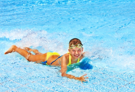 Little girl in swimming pool. Summer outdoor.の写真素材