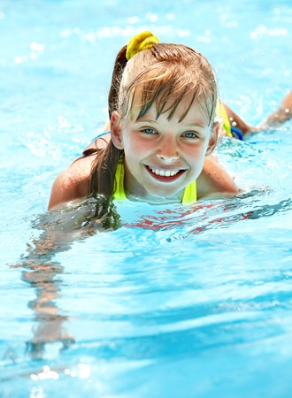 Little girl in swimming pool. Summer outdoor.の写真素材