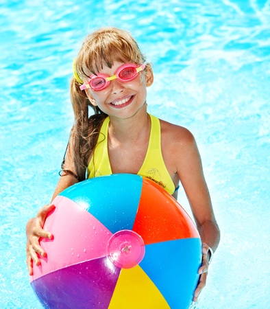 Little girl  swimming in pool.の写真素材