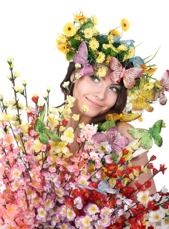 Girl with butterfly and flower on head. Spring hair. Isolated.の写真素材