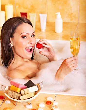 Woman swimming of bath tub.の写真素材