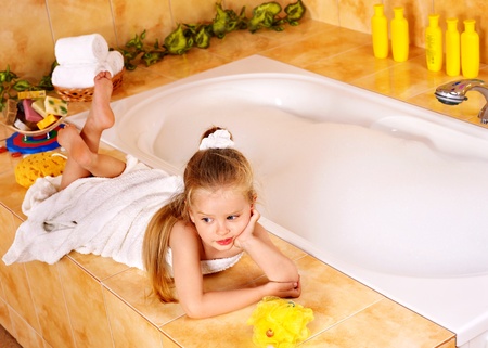 Child washing in bubble bath .の写真素材