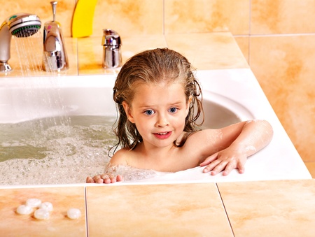 Child washing in bubble bath .の写真素材