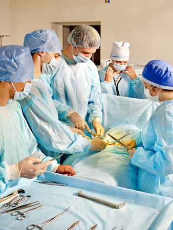 Group of surgeon looking at patient in operation room.の写真素材