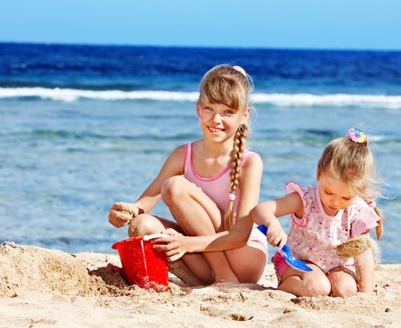 Little girl  playing on  beach.の写真素材