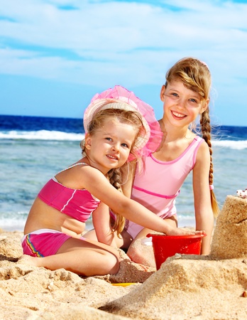 Little girl  playing on  beach.の写真素材