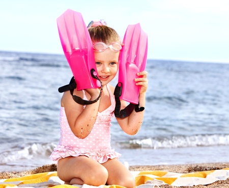 Little girl  playing on  beach.の写真素材