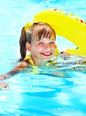 Little girl in swimming pool. Summer outdoor.の写真素材