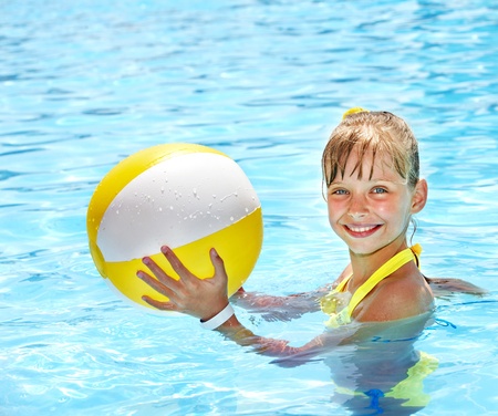 Little girl  swimming in pool.の写真素材
