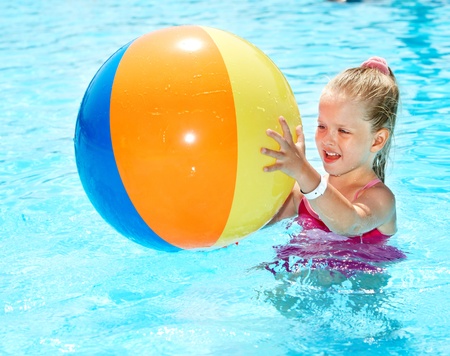 Little girl  swimming in pool.の写真素材