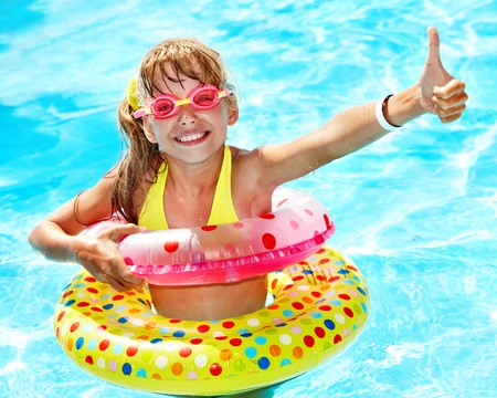 Little girl in swimming pool. Summer outdoor.の写真素材