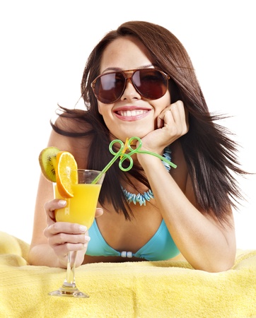 Girl in bikini drink juice through straw. Isolated.の写真素材