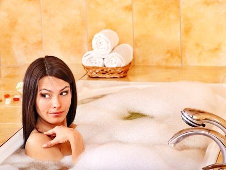 Young woman take bubble  bath.の写真素材