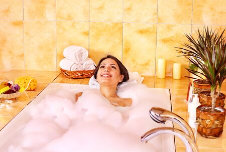 Young woman take bubble  bath.の写真素材