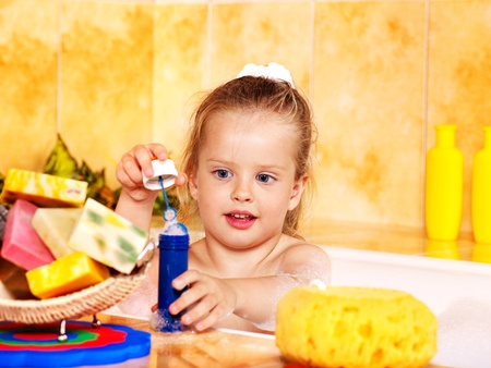 Child washing in bubble bath .の写真素材