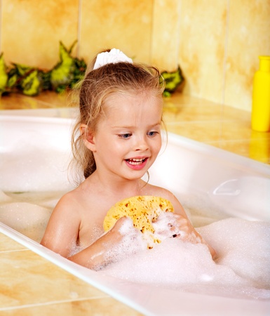 Child washing in bubble bath .の写真素材
