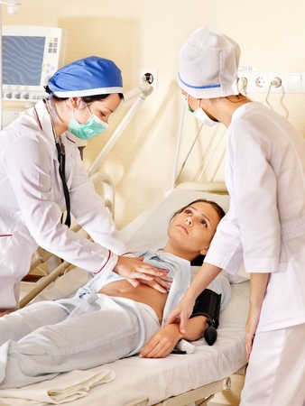 Group doctor treats female patient with stethoscope. Medicine. の写真素材