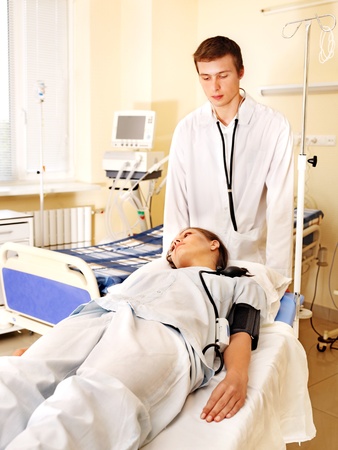Sick patient on gurney in operating room.の写真素材