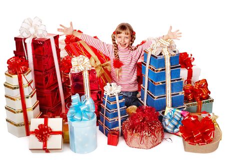 Happy little girl with group gift box. Isolated.の写真素材