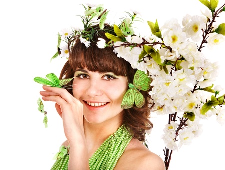 Woman in spring hairstyle and makeup holding flower.の写真素材