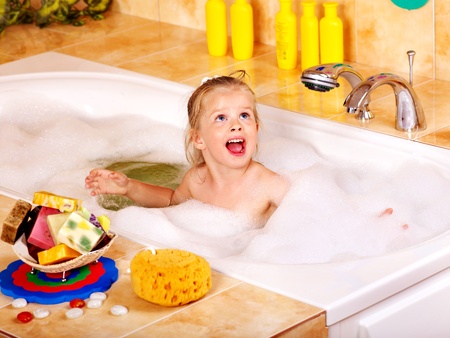 Child washing in bubble bath .の写真素材