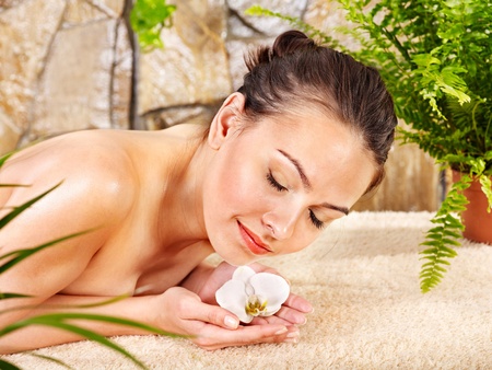 Beautiful young woman getting massage in spa.の写真素材