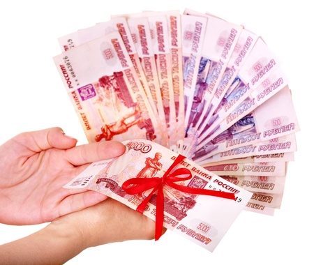 Female hand with  money Russian rouble. Isolated.の写真素材