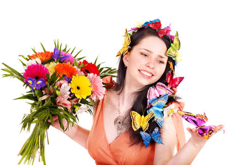 Girl in spring hairstyle with flower and butterfly. Isolated.の写真素材