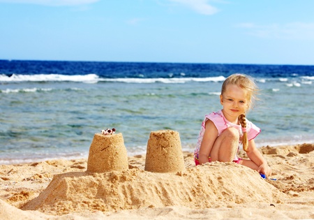 Little girl  playing on  beach.の写真素材