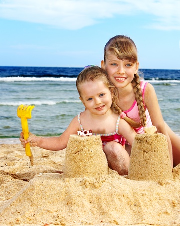 Little girl  playing on  beach.の写真素材
