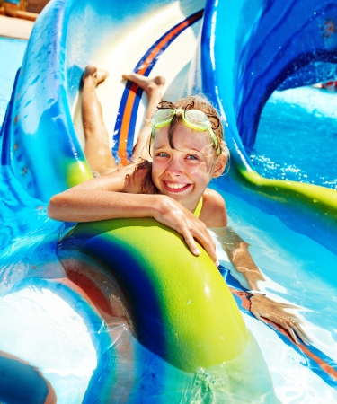 Child on water slide at aquapark Summer holidayの販売画像