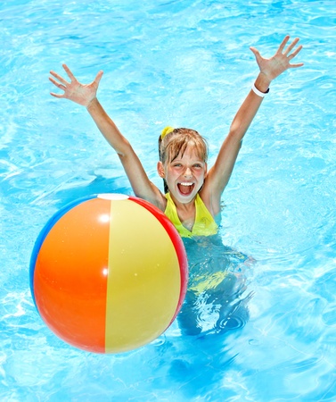 Little girl  swimming in pool.の写真素材