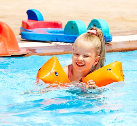 Child on water slide at aquapark. Summer holiday.の写真素材