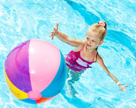 Little girl  swimming in pool.の写真素材