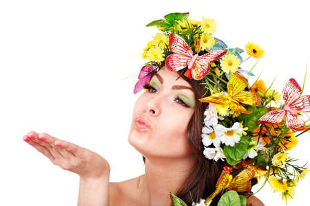 Girl with butterfly and flower on head. Spring hair. Isolated.の写真素材