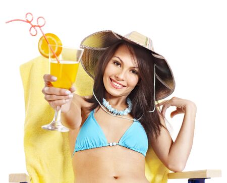 Girl in bikini drink juice through  straw.の写真素材