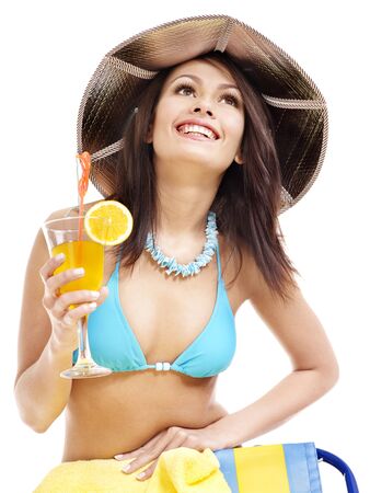 Girl in bikini drink juice through  straw. Isolated.の写真素材