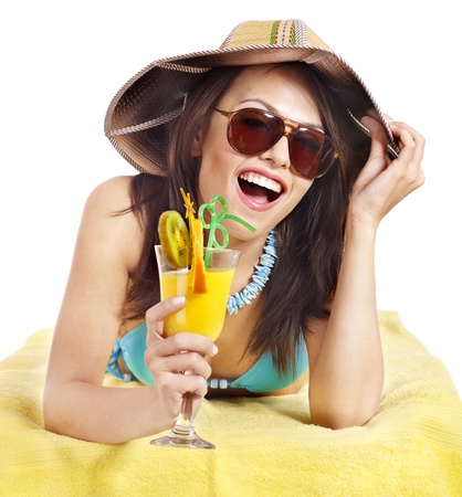 Girl in bikini drink juice through straw. Isolated.の写真素材
