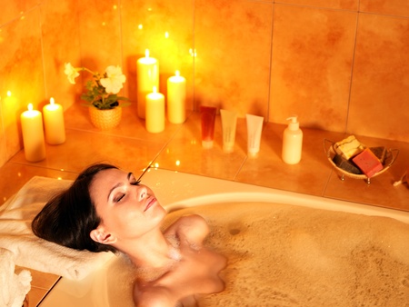 Young woman take bubble  bath.の写真素材