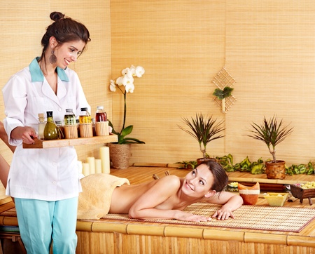 Beautiful young woman getting massage in spa.の写真素材