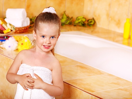 Little girl washing in bubble bath .の写真素材
